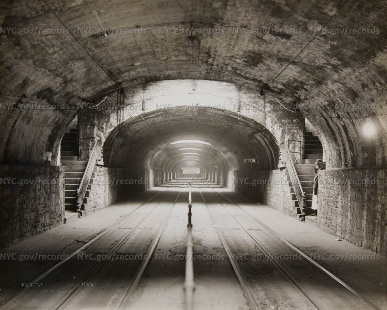 [Looking north from Murray Hill Tunnel Station, 38th Street, Before strip widening, passengers waiting at right]